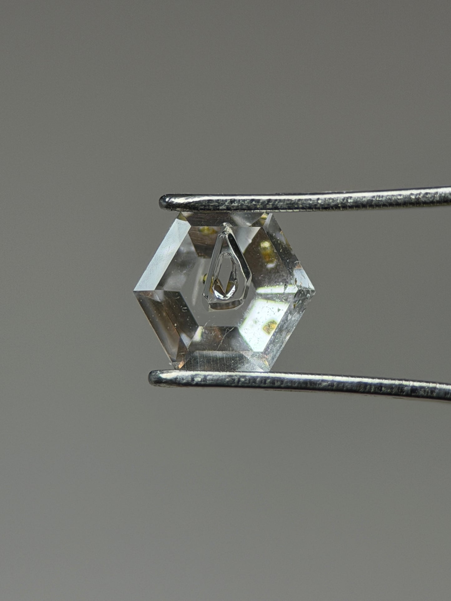 0.31 ct Hexagon Petroleum Quartz with Dual Inclusions – Deep Blue & Golden Fluorescent Negative Crystals – Madagascar