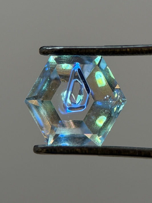 0.31 ct Hexagon Petroleum Quartz with Dual Inclusions – Deep Blue & Golden Fluorescent Negative Crystals – Madagascar