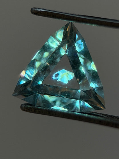 0.46 ct Trillion Cut Petroleum Quartz with Fluorescent Inclusion – Madagascar