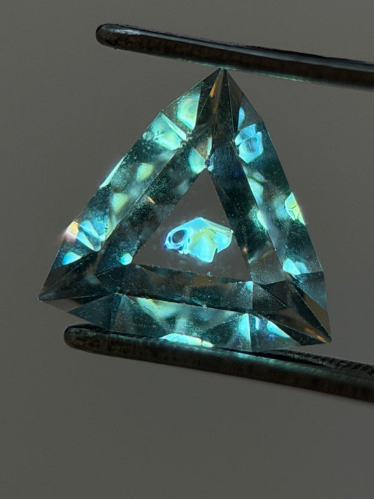 0.46 ct Trillion Cut Petroleum Quartz with Fluorescent Inclusion – Madagascar