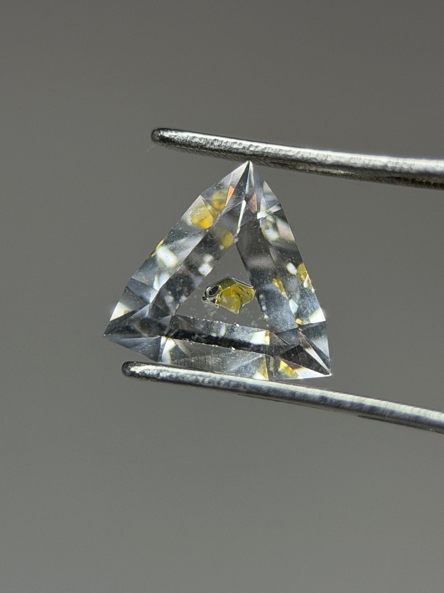 0.46 ct Trillion Cut Petroleum Quartz with Fluorescent Inclusion – Madagascar