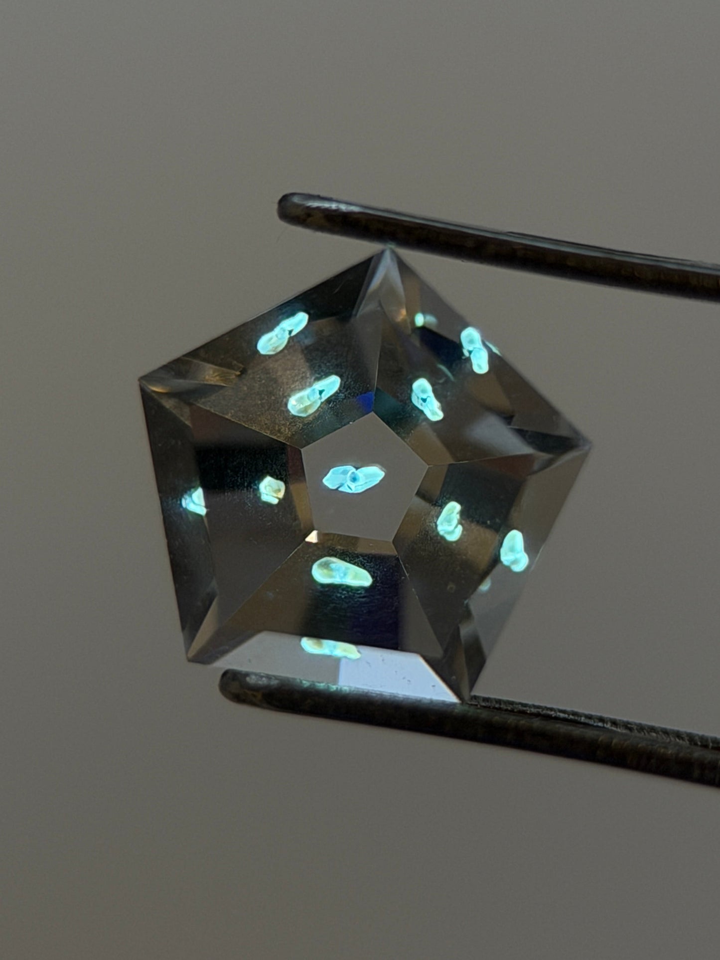 0.62 ct Pentagon Cut Petroleum Quartz with Enhydro Moving Bubble – Madagascar