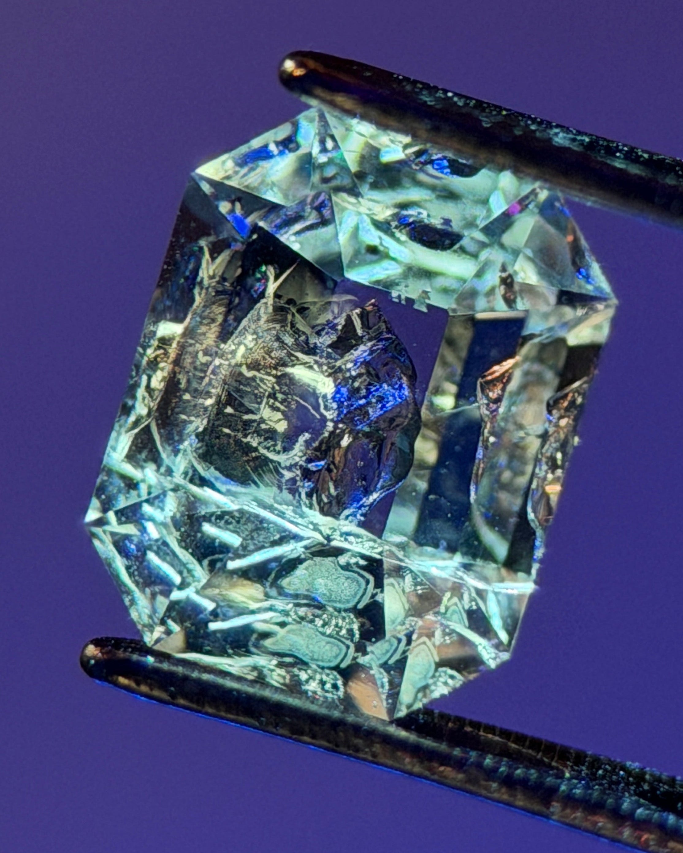 Natural Petroleum Quartz – 0.75 ct Octagon Cut (4.9 x 6.3 mm) – Rainbow Iridescence & Black Mineral