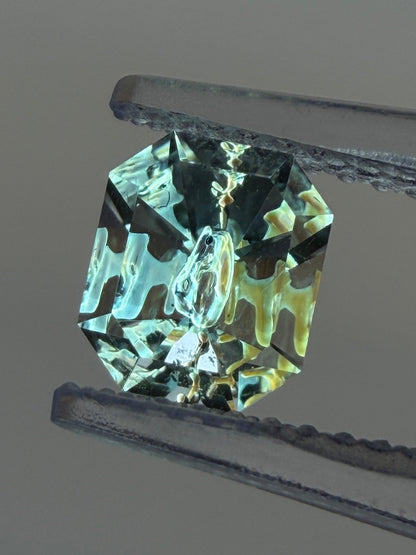 0.79 ct Emerald Cut Petroleum Quartz with Fluorescent Negative Crystal – Madagascar (6.3 x 5.2 mm)