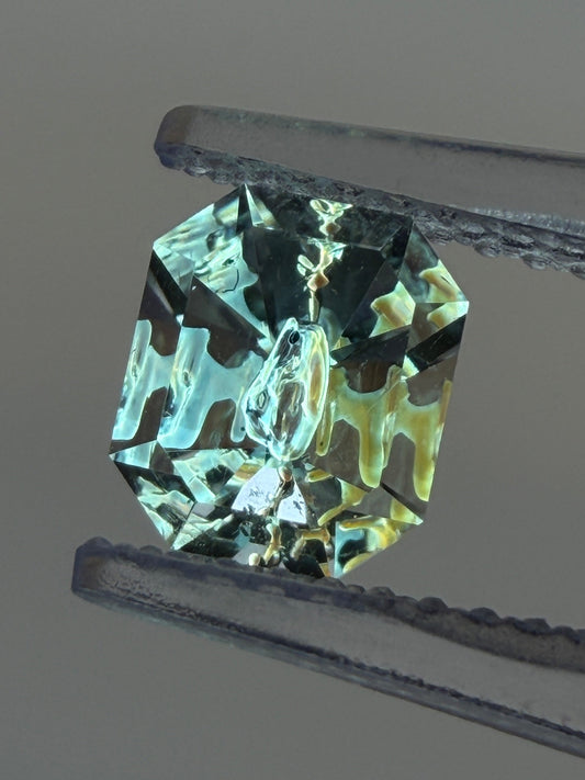 0.79 ct Emerald Cut Petroleum Quartz with Fluorescent Negative Crystal – Madagascar (6.3 x 5.2 mm)