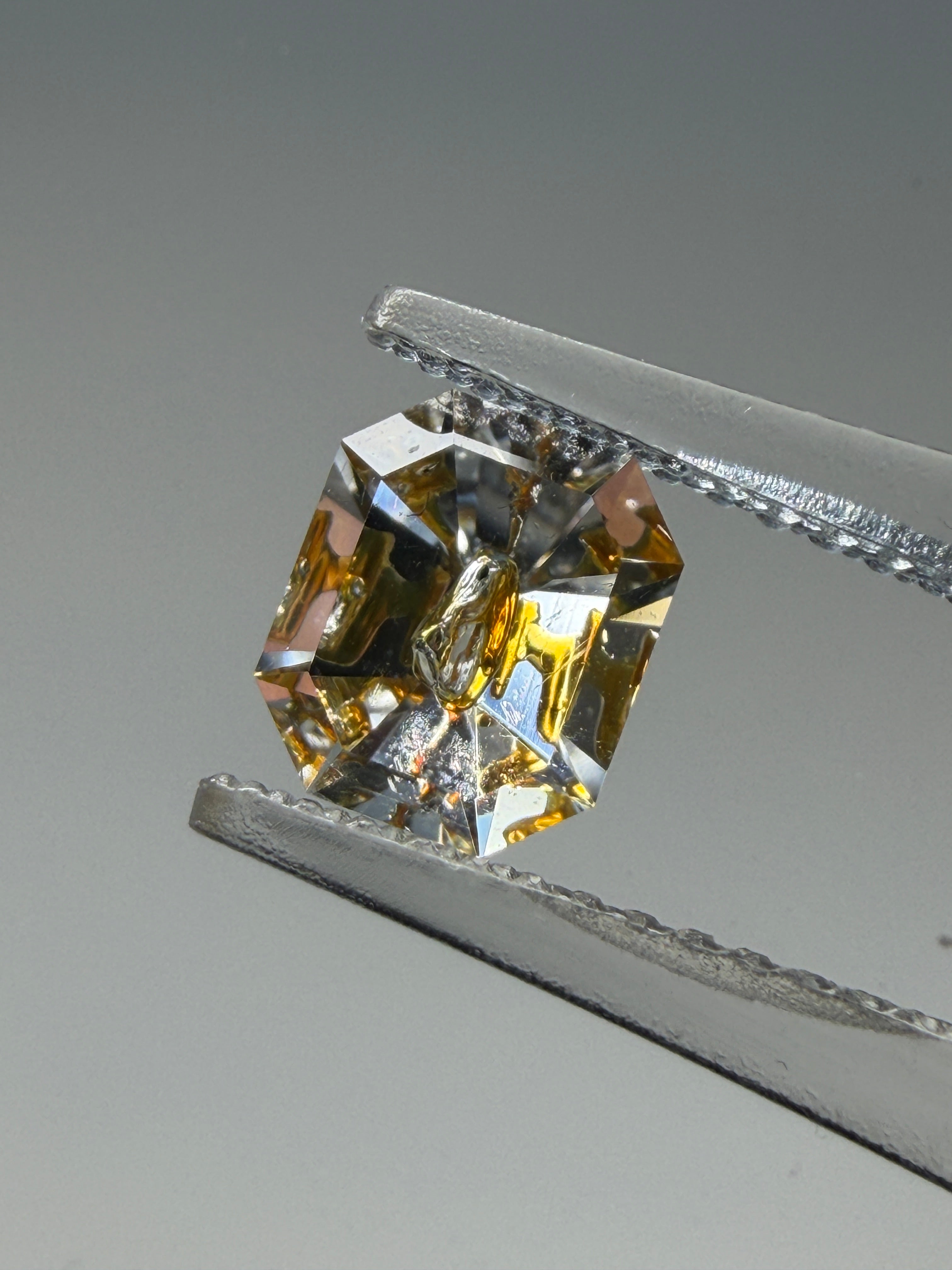 Natural Petroleum Quartz – 0.79 ct Emerald Cut (6.3 x 5.2 mm) – Fluorescent Negative Crystal Cavity