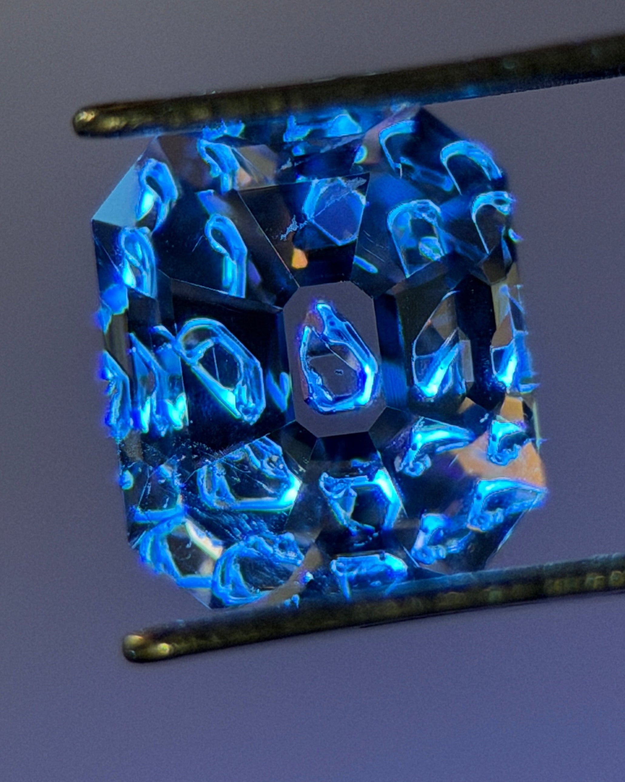 Natural Fluorescent Quartz – 1.11 ct Octagon Cut (5.4 x 6.2 mm) – Intense Blue Fluorescent Chamber